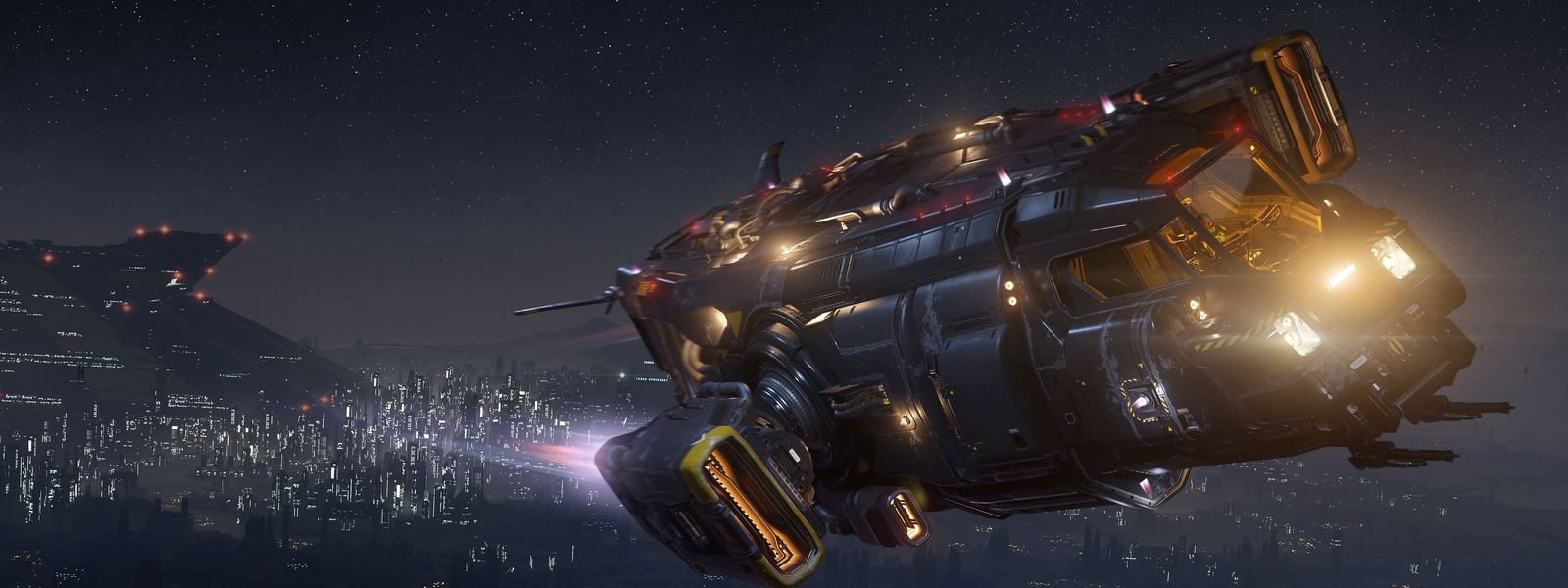 A heavy hauler coming in low over a city at night